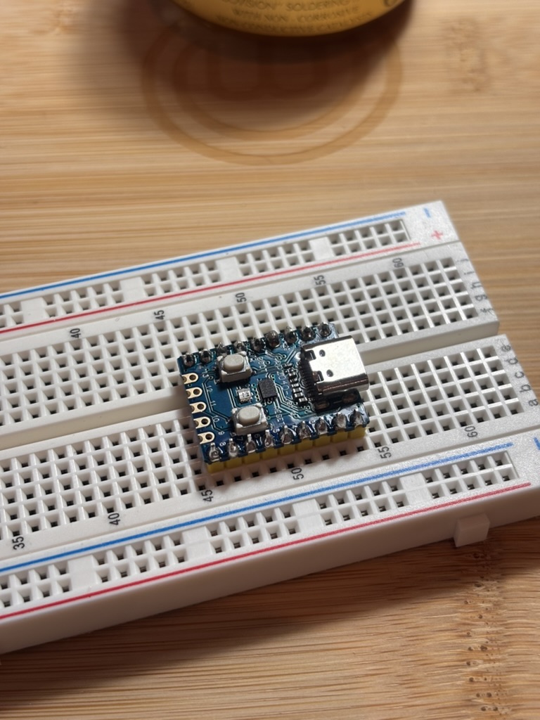 A breadboard with a tiny chip on it